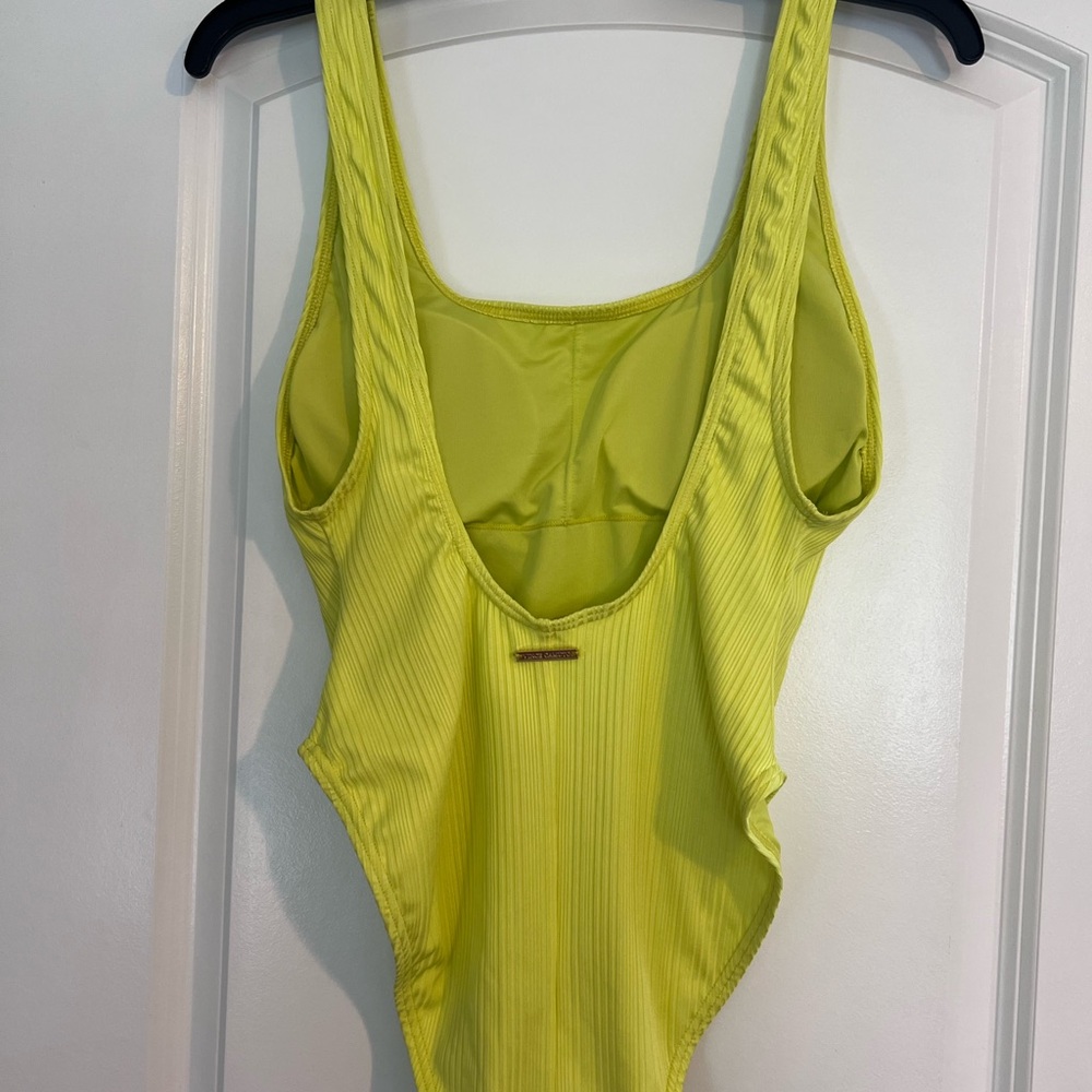 Vince Camuto  Lemon One Piece Swimsuit. Runs a size smaller than listed. NWT